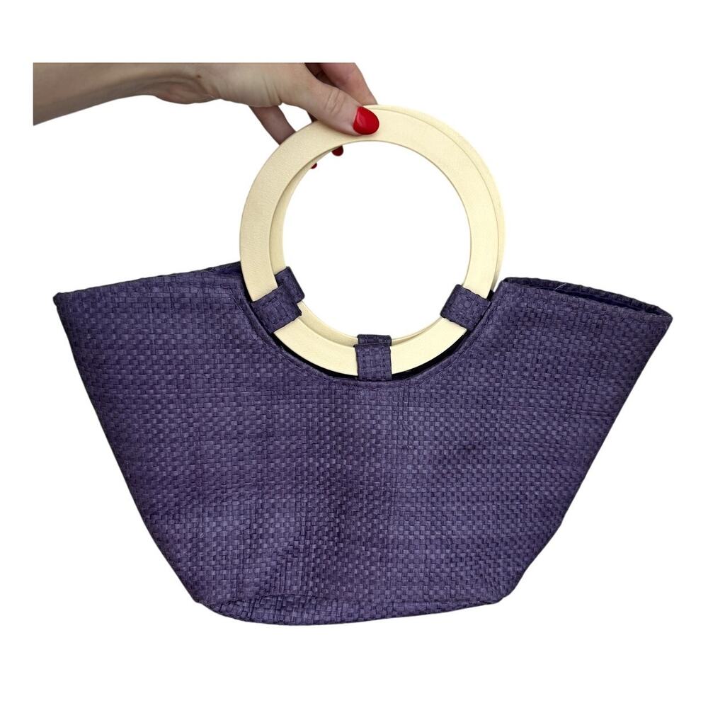 purple straw woven tote bag with round wooden handles summer beach vacation boho